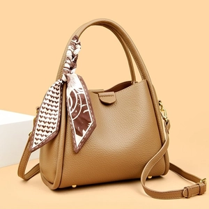 Brown litchi grain leather handbag with decorative scarf and golden hardware accessories
