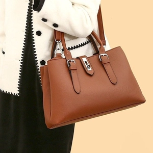 Brown lychee-grain PU leather tote bag with silver hardware and shoulder strap