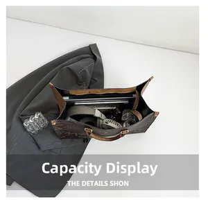 Top view of spacious monogram tote bag showing interior storage for laptop and essentials