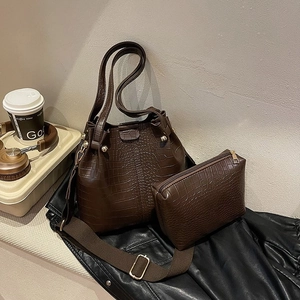 Brown crocodile embossed bucket handbag with matching pouch and wide shoulder strap