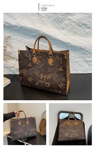 Detailed coffee tote bag with QIANWEI print and reinforced leather handles