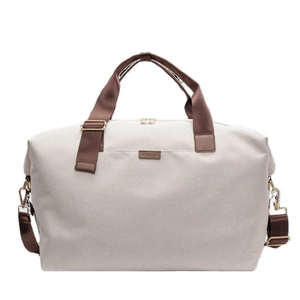 Large beige canvas travel tote bag with brown straps and detachable shoulder strap