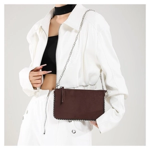 Brown frosted leather shoulder bag with silver bead trim and a thin metal chain strap