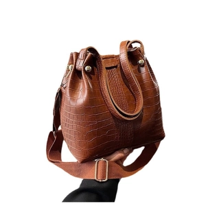 Dark brown faux leather bucket bag with crocodile texture and adjustable strap