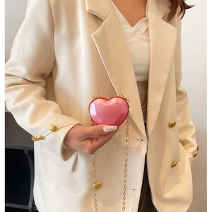 Pink heart-shaped mini acrylic bag with geometric facets and golden metal chain