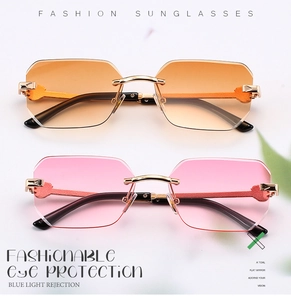 Detail of rimless sunglasses with gradient lenses and heart-shaped metal hinge accents