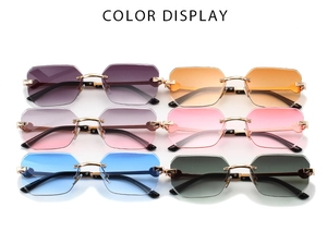 Detailed color display of rimless sunglasses with gradient lenses and gold metal frames