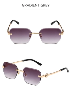 Detail of rimless gradient grey sunglasses with golden metal hinges and purple lenses