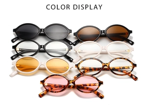 Collection of retro oval eyeglass frames in black, tortoiseshell, and white colors