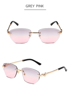 Détails des verres dégradés gris rose et branches en métal doré sur lunettes sans monture