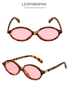 Detail view of leopard tortoise frame with pink lenses and metal temple accents
