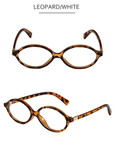 Detail of leopard print oval glasses frame with golden metal geometric accents on temples
