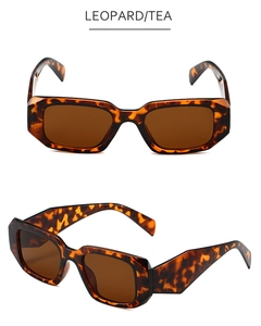 Detail view of vintage leopard print rectangular sunglasses with tea tinted lenses
