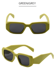 Detail view of olive green rectangle sunglasses featuring unique angular temple cutting