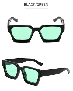 Détails de lunettes de soleil à monture épaisse noire avec des verres verts rétro