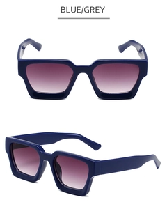 Gros plan sur des lunettes de soleil carrées bleues à monture épaisse et verres dégradés