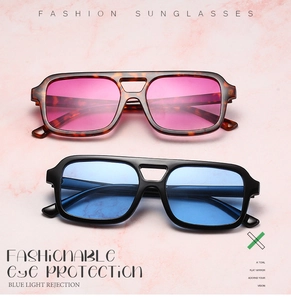 Detail of square double-bridge pilot sunglasses in tortoiseshell and glossy black frames