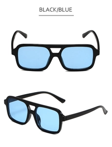 Detail of retro double-bridge pilot sunglasses with black frame and blue lenses