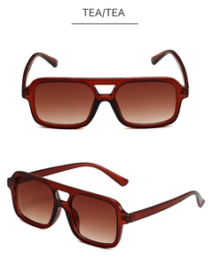 Detail of retro pilot sunglasses with square frames, tea gradient lenses and double bridge