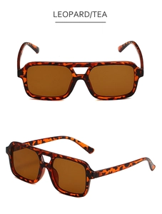 Detail of square double-bridge pilot sunglasses with leopard frame and tea lenses