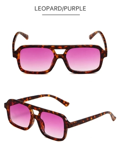 Detail view of square double-bridge sunglasses with leopard frame and purple gradient lenses