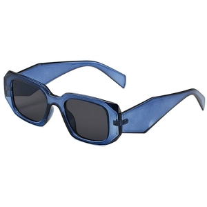 Retro square sunglasses with navy blue transparent frames and angular cut-out side design