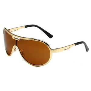 Retro oversized shield sunglasses with gold metal frame and brown lenses in a frontal view