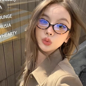 Retro oval tortoiseshell eyeglasses with blue light blocking lenses worn by a model