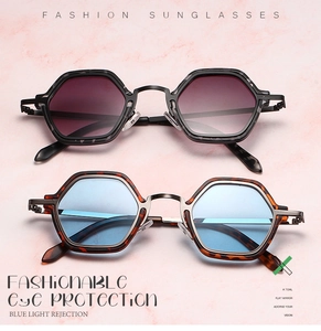 Detail of hexagonal sunglasses with tortoiseshell frames and blue light blocking lenses