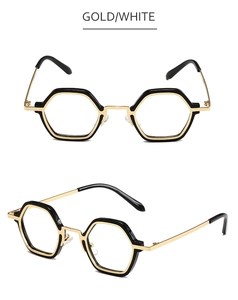 Detailed view of small gold hexagonal metal frames with clear lenses from multiple angles