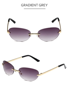 Detail view of oval rimless sunglasses with gradient grey lenses and gold temples