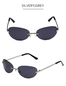 Detail view of silvery metal bridge and grey rimless Y2K oval sunglasses lenses