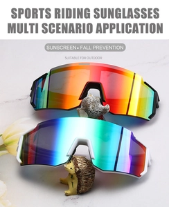 Dual sports cycling sunglasses with colorful polarized lenses on white marble surface