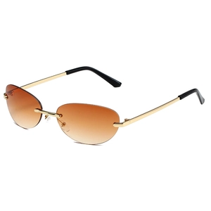Y2K rimless oval sunglasses with gradient orange lenses and slim golden metal frames