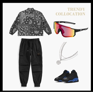 Flat lay of sporty outfit with red mirror sunglasses, paisley jacket and high-top sneakers