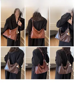 Detailed views of vintage hobo tote bag featuring side drawstrings and contrast stitching