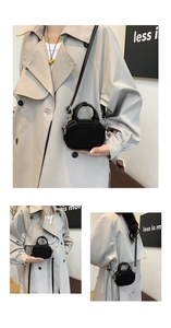 Detail showing high-quality stitching on minimalist black crossbody bag for women
