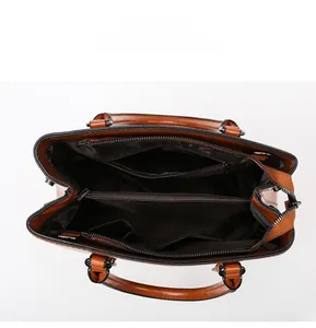 Internal display of large brown leather tote bag with multiple storage compartments
