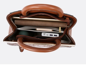 Interior view showing the organized compartments of the brown leather commuter handbag