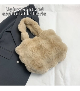 Close-up of beige faux fur handbag showing plush texture on a grey blazer suit