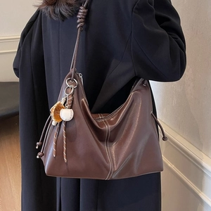 Brown soft leather Hobo tote bag with contrast stitching and baseball charm detail
