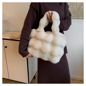 Close-up of white plush crossbody bag featuring textured plaid faux fur and soft material