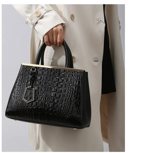 Minimalist black crocodile pattern leather handbag for women with gold hardware and top handles