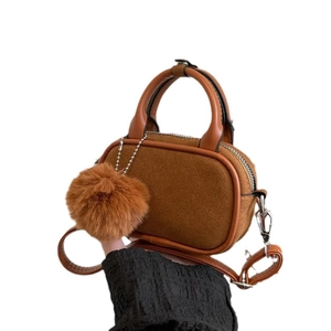 Caramel stitching small square bag with plush ball charm and top handle
