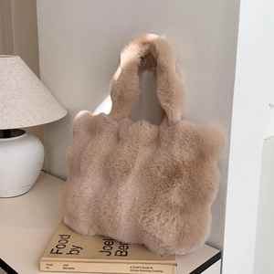 Close-up of soft beige faux fur texture on a plush tote bag for winter fashion
