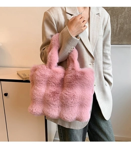 Chic pink faux fur tote bag for women with plush texture and spacious shoulder strap design
