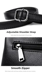 Detail of adjustable strap with silver buckle and smooth metal zipper on black leather bag