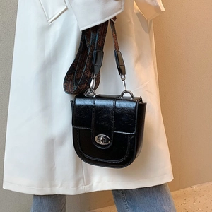 Retro black leather hobo bag with bohemian wide strap and silver metal buckle