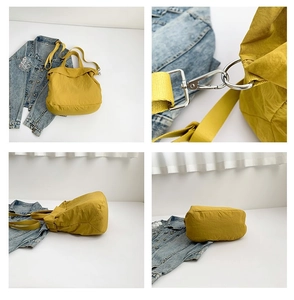 Detailansicht der gelben Canvas-Tasche mit Metallschnallen und verstellbarem Gurt