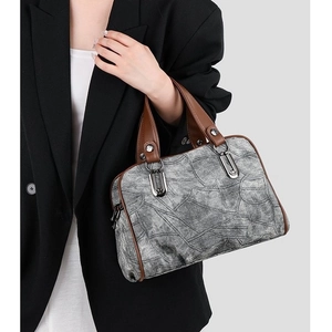 Vintage denim grey patchwork handbag with brown leather straps and silver metal buckles